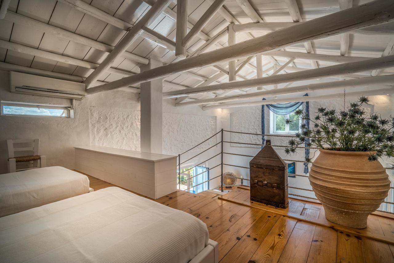 Askos Stone Villa - The Island Panorama อายิโอสนิโกลาโอส ภายนอก รูปภาพ